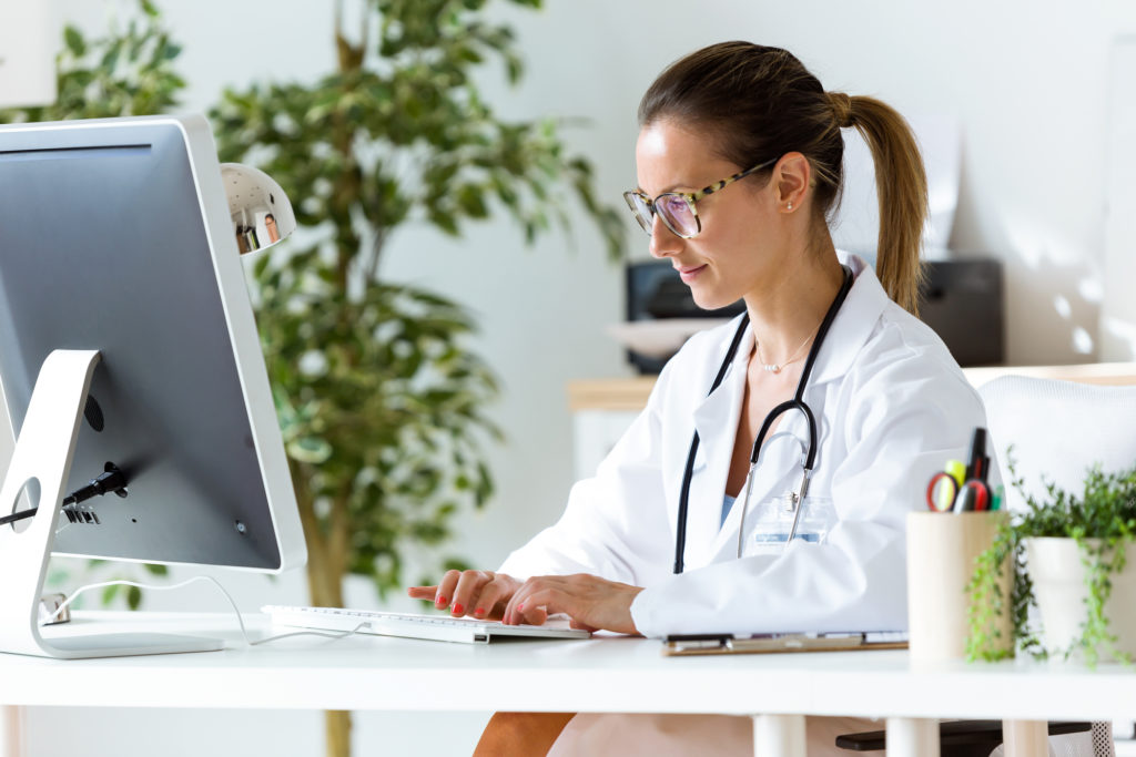 Doctor Working on Laptop